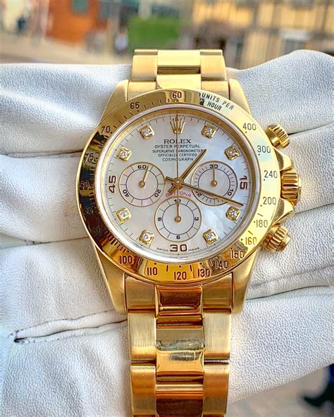 gold Rolex daytona watch